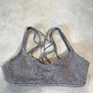 Lululemon sports bra. Size 10. Pads in. Crisscross back. Gray Black White